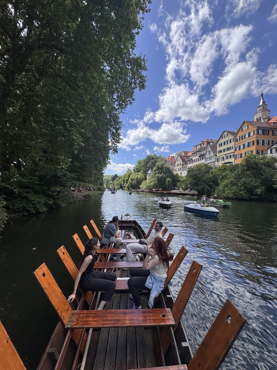 Punt on the Neckar in front of the colourful houses and the Hölderlin Tower in Tübingen